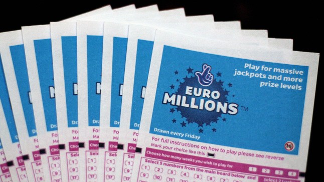Lottery tickets for the EuroMillions jackpot are displayed in central London, on February 8, 2008. Lottery history could be made later Friday in the EuroMillions draw. The 95m (approx 127.6m euros/185m USD) prize will be the biggest pay-out of its kind in the world if it is won by a single ticket holder. AFP PHOTO/SHAUN CURRY (Photo credit should read SHAUN CURRY/AFP via Getty Images)
